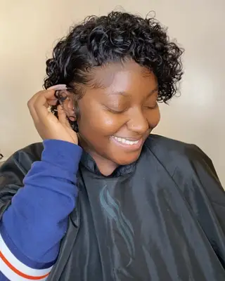 Person with curly short asymmetrical bob
