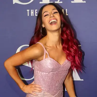 Samantha Pauly poses with bold pink ombré hair