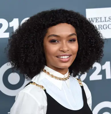 Yara Shahidi with a voluminous curly hairstyle and micro bangs at 2018 GLSEN Respect Awards in Beverly Hills, California