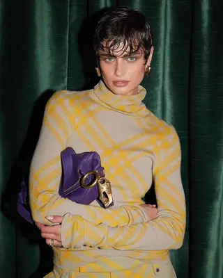 Taylor Hill with a wet pixie and bangs for a Burberry campaign