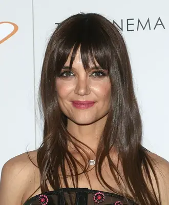 Close up of Katie Holmes with long straight hair and wispy bangs