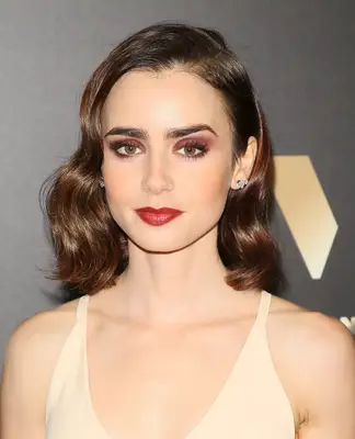 Close up Lily Collins with wavy bob and burgundy smoky eye
