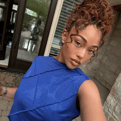 jordyn woods with curly updo