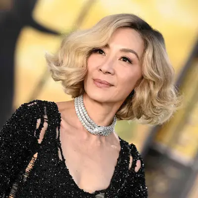 Michelle Yeoh with a blonde voluminous long bob