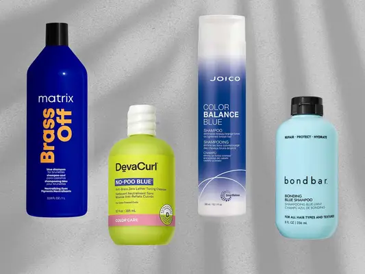 Matrix Brass Off Blue Shampoo, Bondbar Bonding Blue Shampoo, DevaCurl No-Poo Blue Anti-Brass Zero Lather Toning Cleanser, and Joico Color Balance Blue Shampoo on a grey textured background