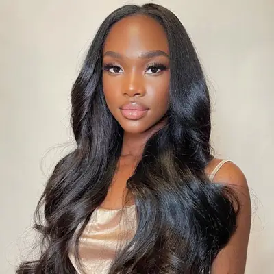 Actress Rose Byrne in white robe with bouncy short hair