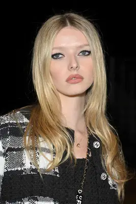 Apple Martin wearing eyeliner and a tweed jacket