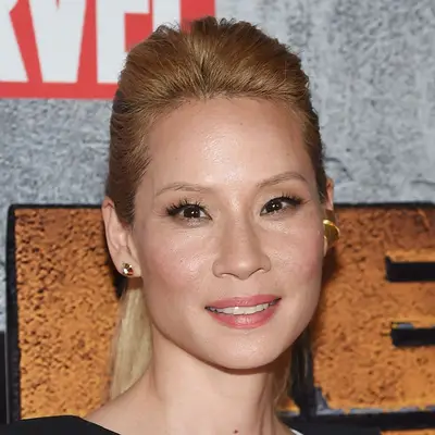 Lucy Liu wears a blonde ponytail with a voluminous crown