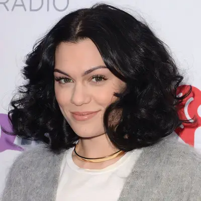 Jessie J wears a brushed-out curly bob hairstyle