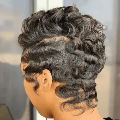 Model with a short, finger waved pixie.