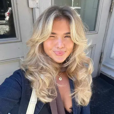 person with butterfly graduated haircuts