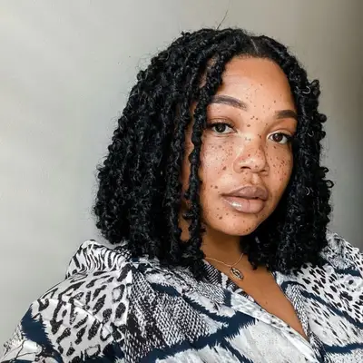 Woman with short bob-length mermaid locs