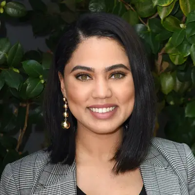 Ayesha Curry wears a straightened long bob with side part and statement earring