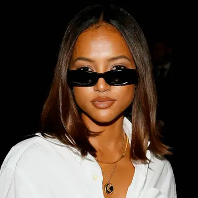 Karrueche Tran wears a blown-out bob hairstyle and rectangle sunglasses