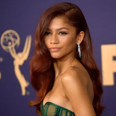 Zendaya with side-parted long soft waves