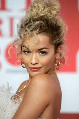 Rita Ora high messy curly bun