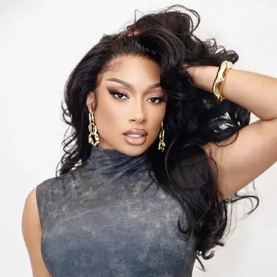 Megan Thee Stallion with brown bouncy blowout