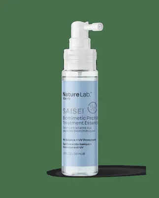 Naturelab Tokyo Saisei Hair Essence on a blue background