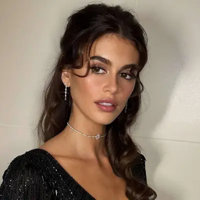 Kaia Gerber with half-up, half-down brown hair