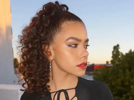 Actor Antonia Gentry with a curly high ponytail