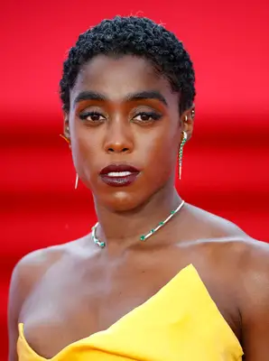 Lashana Lynch short curly natural pixie