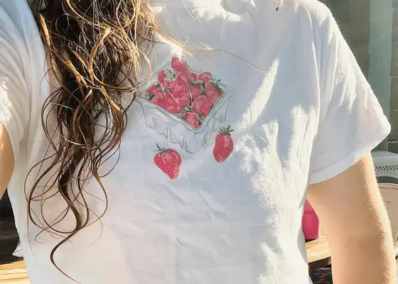 close up of wet wavy hair on strawberry t shirt