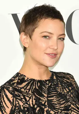 Kate Hudson with a brunette pixie crop on the red carpet