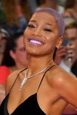 Keke Palmer with a lilac-colored buzz cut on the red carpet