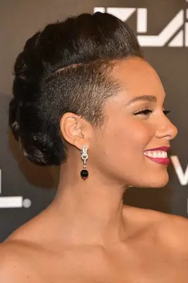Alicia Keys with a side-shaved mohawk on the red carpet