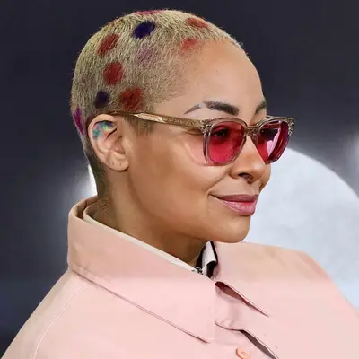 Raven-Symoné with multicolored polka dot and blonde buzzed hair at the 2023 
