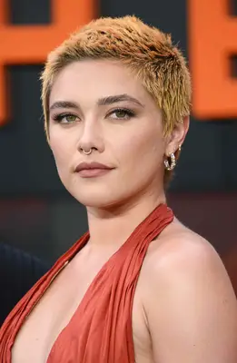 Florence Pugh with an orange buzz cut