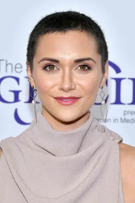 Alyson Stoner with a clipped buzz cut on the red carpet