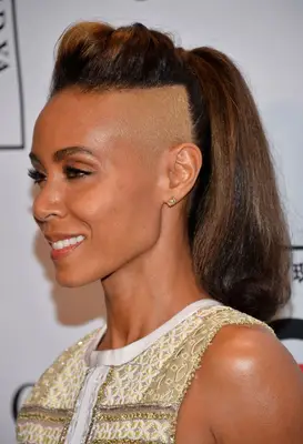Jada Pinkett Smith with sculpted undercut and long, voluminous ponytail on the red carpet