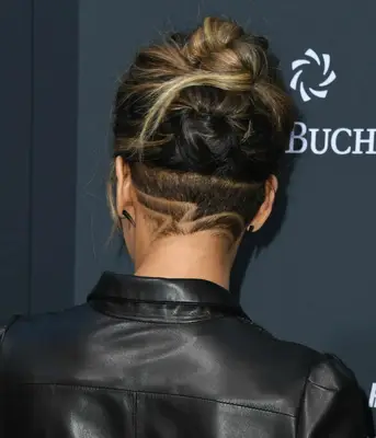 Halle Berry with an abstract buzzed design underneath a black-to-blonde twisted updo on the red carpet