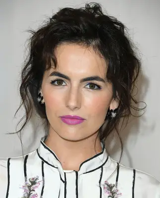 Camilla Belle with a mussy, tousled updo