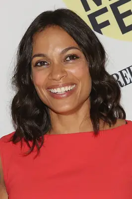 Rosario Dawson with short curly hair