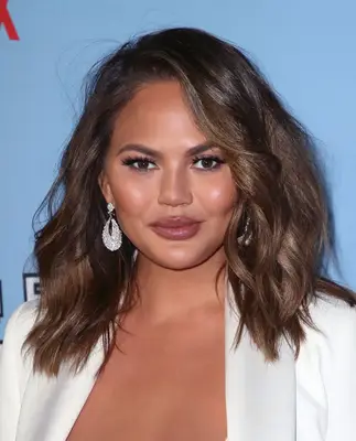 Chrissy Teigen with wavy medium-length hair