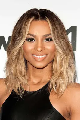 Ciara with golden balayage and a wavy lob