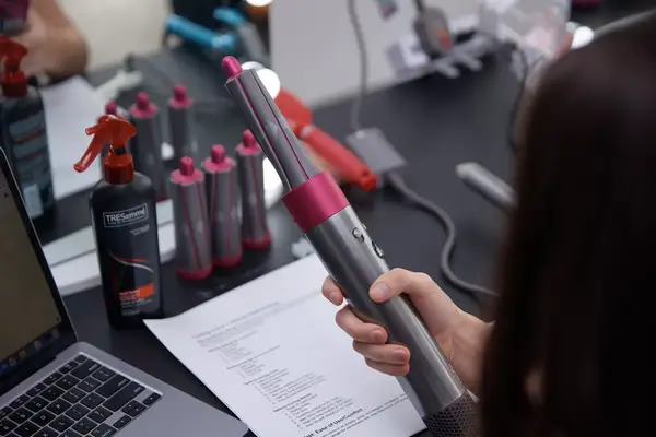 Person holding the Dyson Airwrap Multi-Styler Complete Long