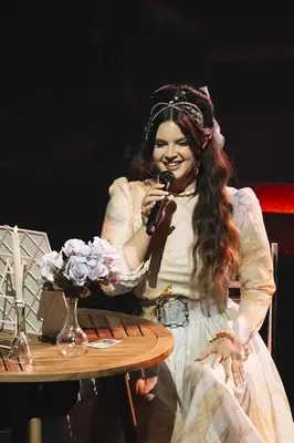 Lana Del Rey performing wearing big hair