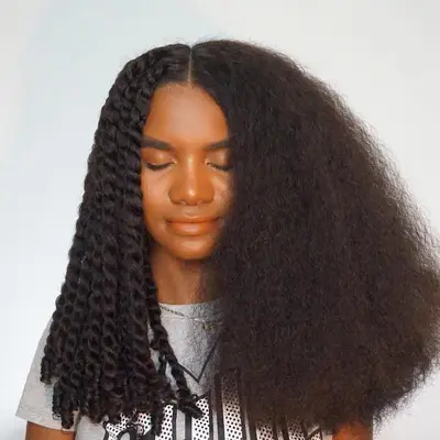 Woman with mini Havana twists halfway in progress