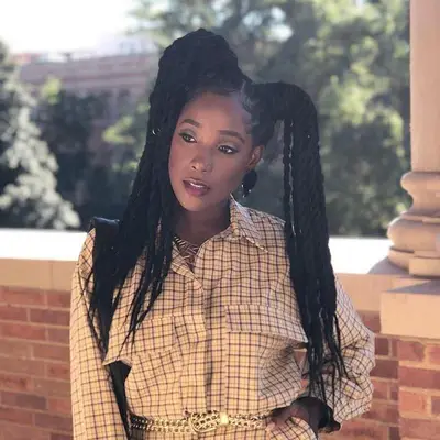 Ashley Blaine Featherson-Jenkins wears Havana twists in high pigtails