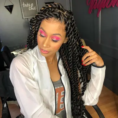 Woman wears jumbo Havana twists and hot pink eyeshadow