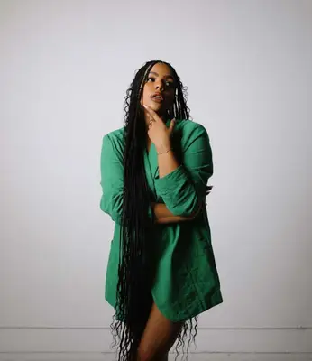 Woman with long boho box braids to her knees