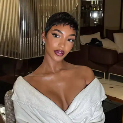 Jourdan Dunn with short hair in an indoor setting