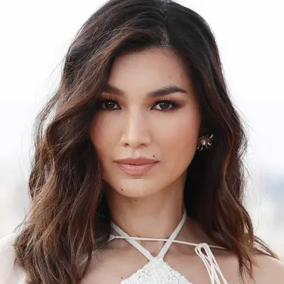 Gemma Chan with wavy black and brown hair at the 2021 