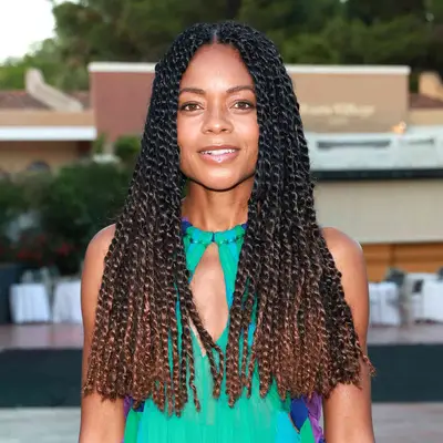 Naomie Harris with black and brown balayage twists at the 2022 Filming Italy red carpet in Santa Margherita di Pula, Italy