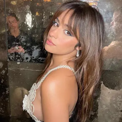 Camila Cabello with full fringe and ombré brown hair