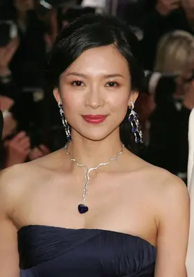 Ziyi Zhang with a deep sidde part and silver accessories