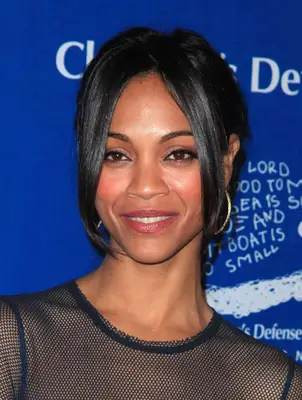Zoe Saldana with face-framing tendrils and an updo
